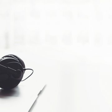 voip services features axvoice open laptop and headset over keyboard